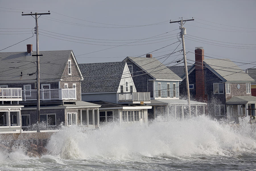 Ocean Storm Waves Crashing into Seawall in front of Houses Photograph by Gmcoop