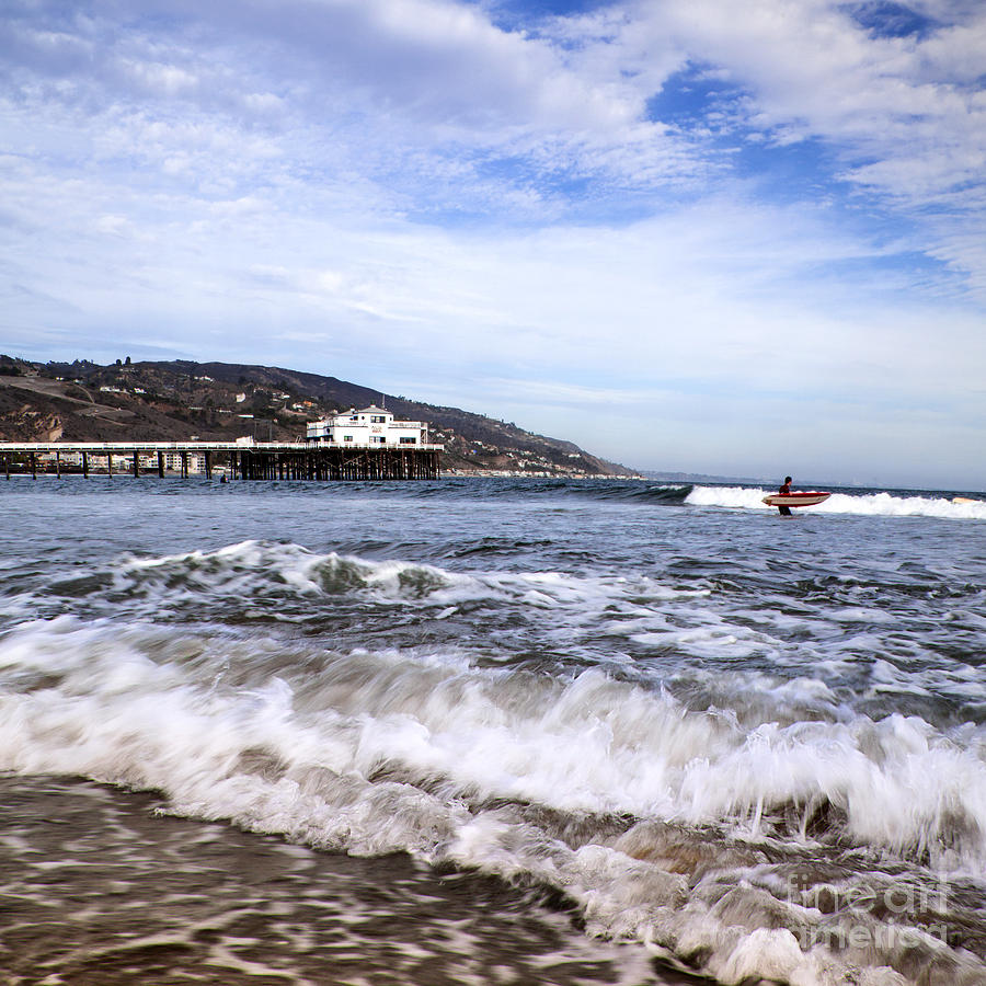Ocean Waves Blue Sky And A Surfer At Malibu Beach Pier Photograph by Jerry Cowart