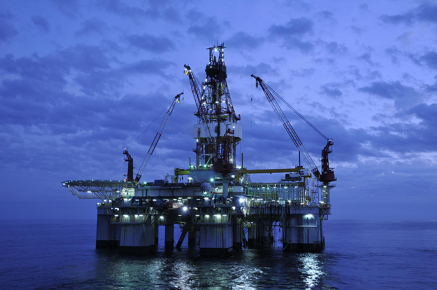 Off Shore Drilling Platform at Twilight. Oil rig and reflection Photograph by Landbysea