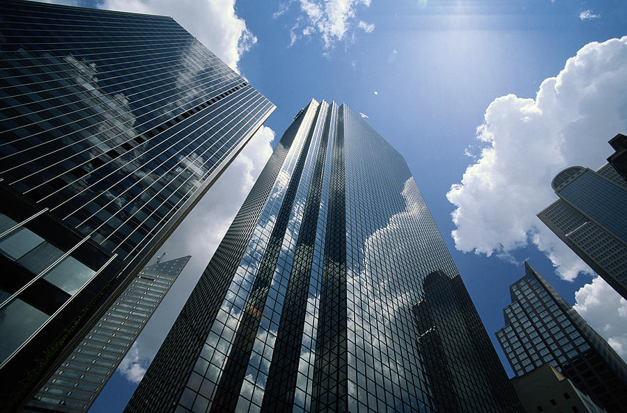Office buildings reflecting clouds, low angle view Photograph by Skip Nall