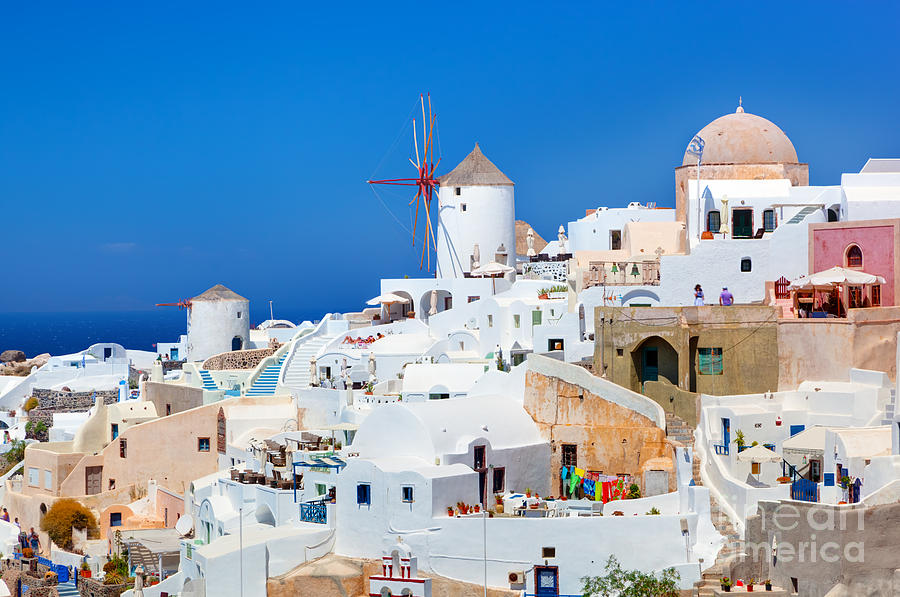 Oia town on Santorini Greece Famous windmills Photograph by Michal Bednarek