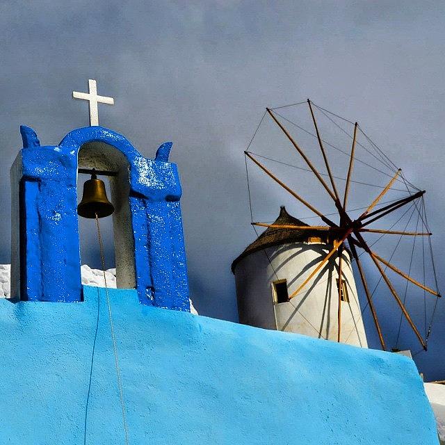 Windmill Photograph - Oia Windmill & Churchbell by Carlos Macia Perez