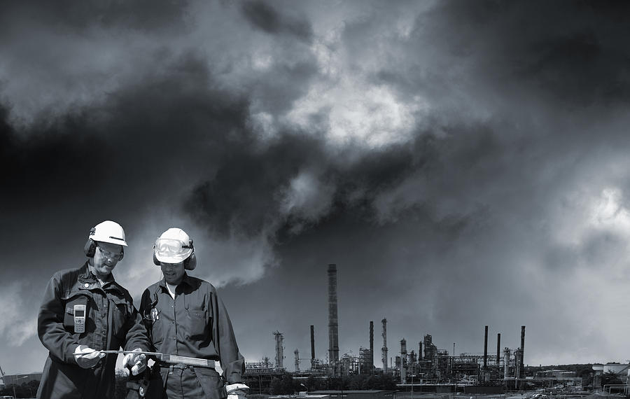 Oil Industry Workers Pollution And Power Photograph by Christian Lagereek