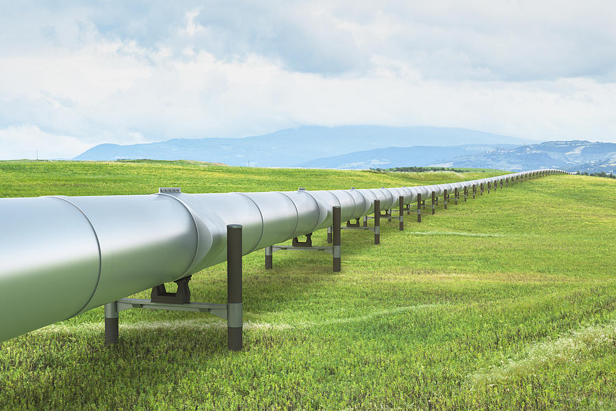 Oil pipeline in green landscape Photograph by Spooh