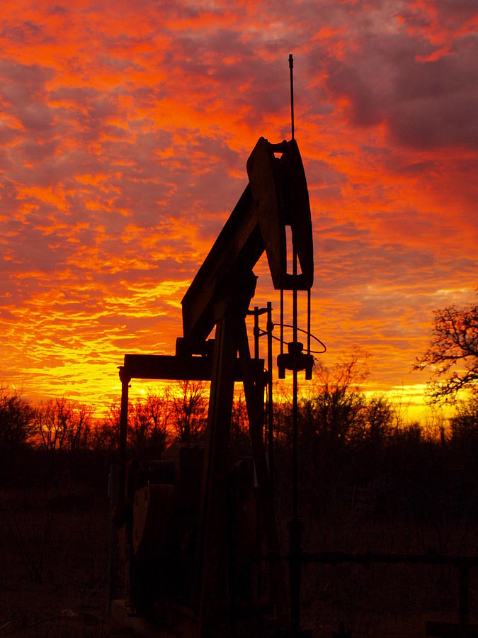 Oil Pump Beneath A Blazing Sky Photograph by James Granberry