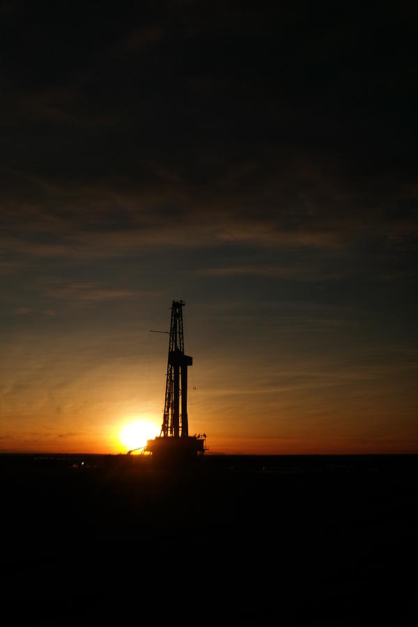Sunset Photograph - Oil rig at sundown by Jeff Swan