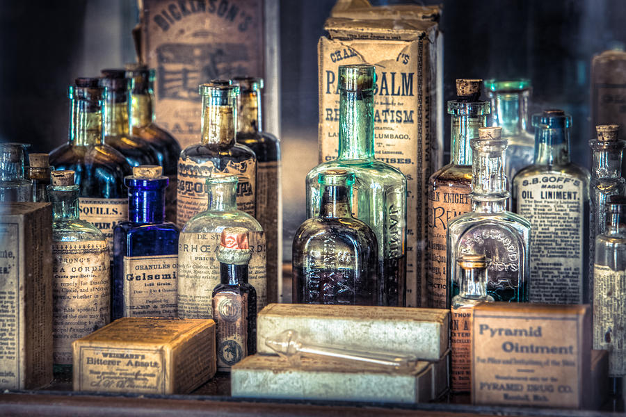 Surrealism Photograph - Ointments Tonics and Potions - A 19th Century Apothecary by Gary Heller