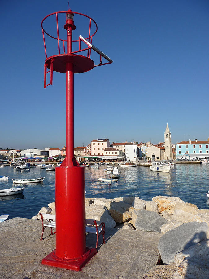 Old adriatic Town of Fazana behind red beacon Photograph by Brch Photography