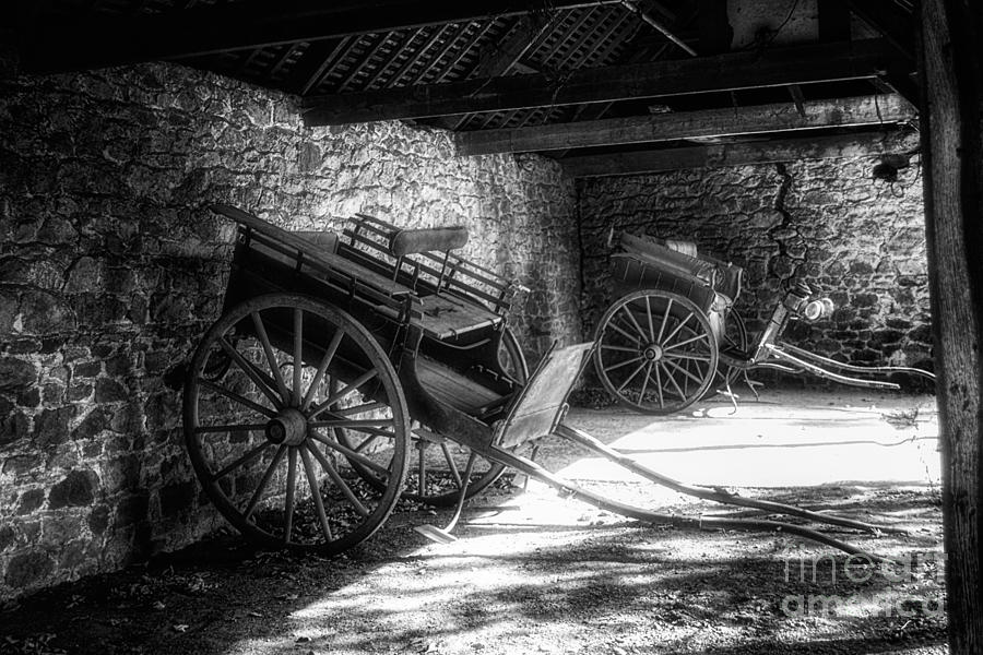 Old Barn and Horse Carriages Monochrome Photograph by Ann Garrett