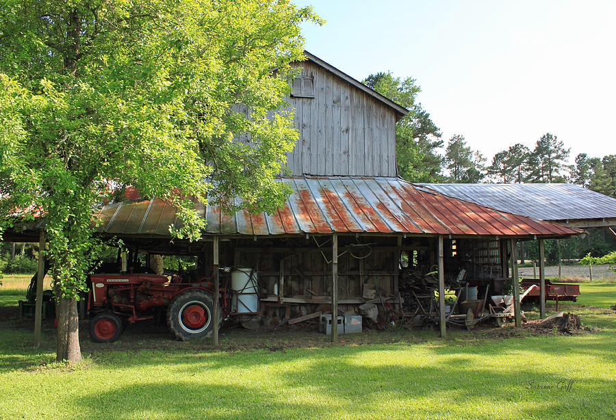 Architecture Photograph - Old Barn with Red Tractor by Suzanne Gaff
