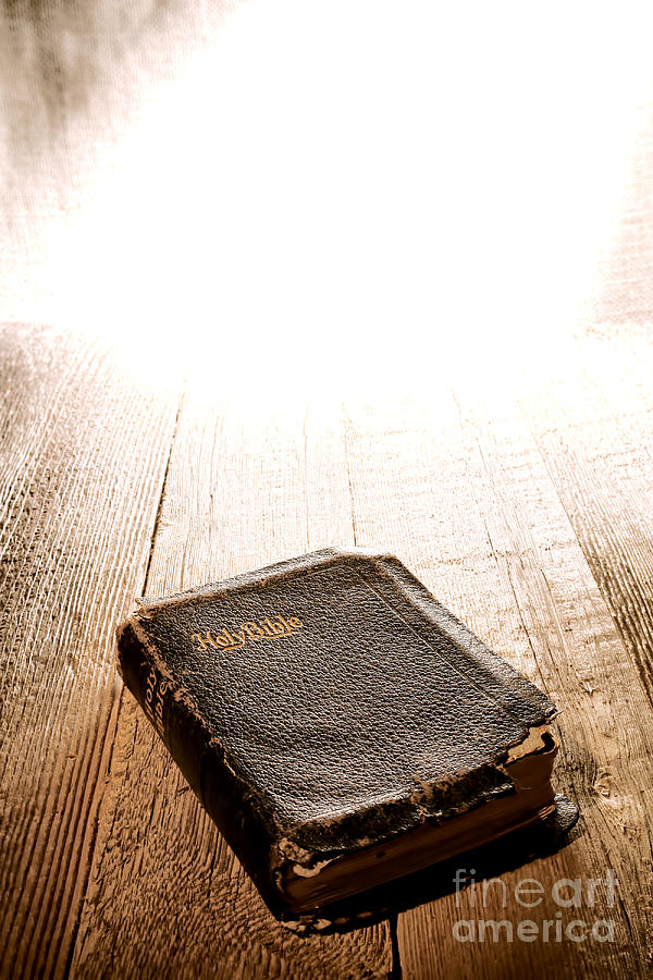 Old Bible in Divine Light Photograph by Olivier Le Queinec