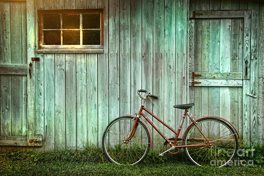 Old bicycle leaning against grungy barn Photograph by Sandra Cunningham