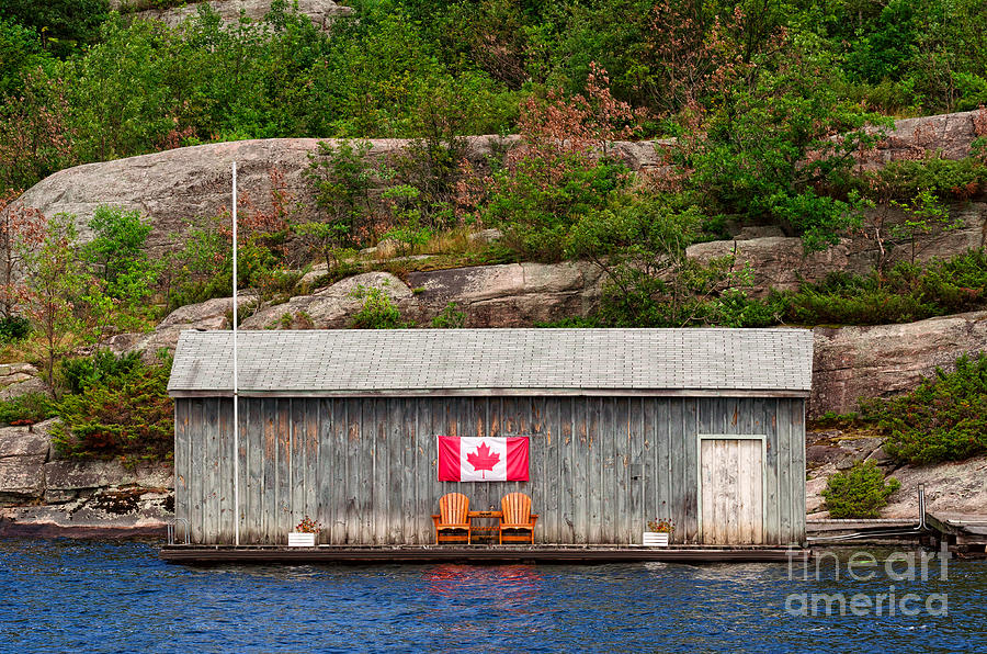 Old boathouse with two Muskoka chairs Photograph by Les Palenik