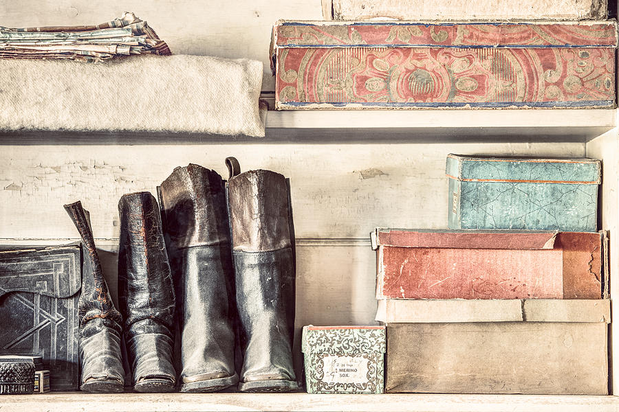 Old boots and boxes - on the shelves of a 19th century General Store Photograph by Gary Heller