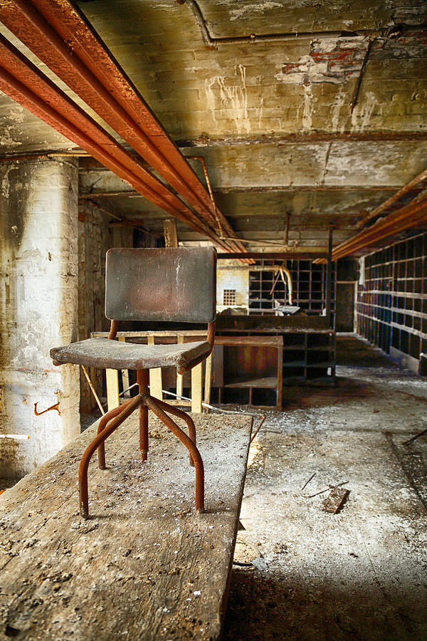 Vintage Photograph - Old chair sits in an abandoned room by Russ Dixon