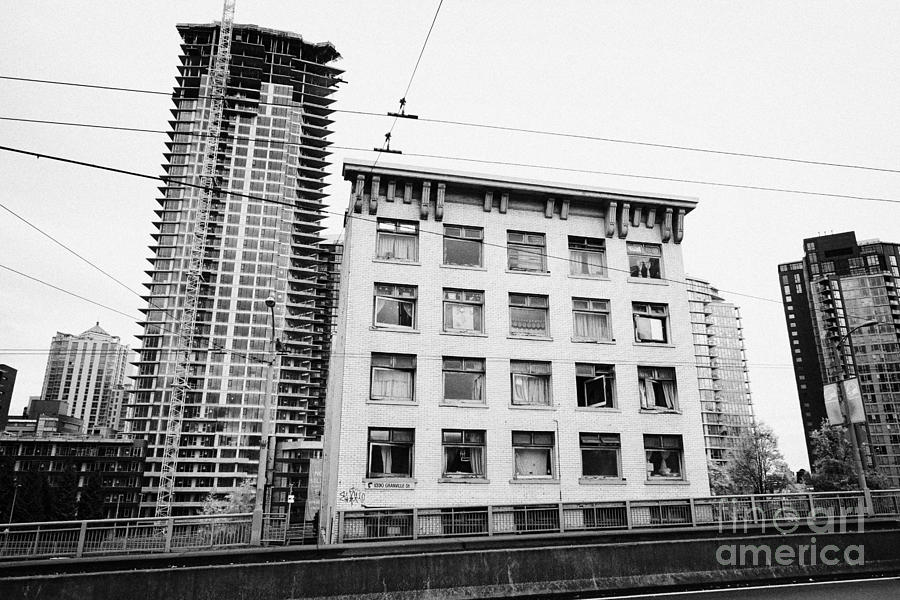 Architecture Photograph - old continental hotel in front of the mark new condo project granville street yaletown Vancouver BC  by Joe Fox