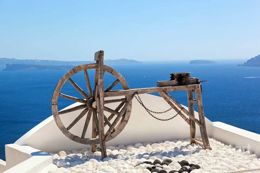 Old craftsmanship machine on the roof in Santorini Photograph by Michal Bednarek