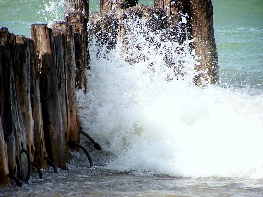 Old Dock Pilings Beaten by Waves Photograph by Kathleen Luther