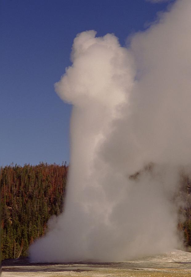 Yellowstone National Park Photograph - Old Faithful in Yellowstone National Park by Retro Images Archive