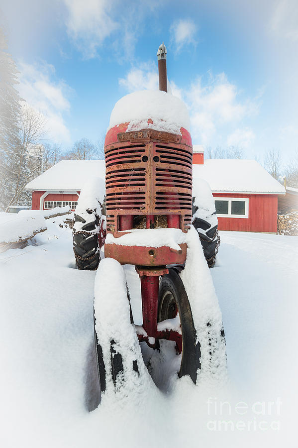 Old Farm Tractor in the Snow Photograph by Edward Fielding