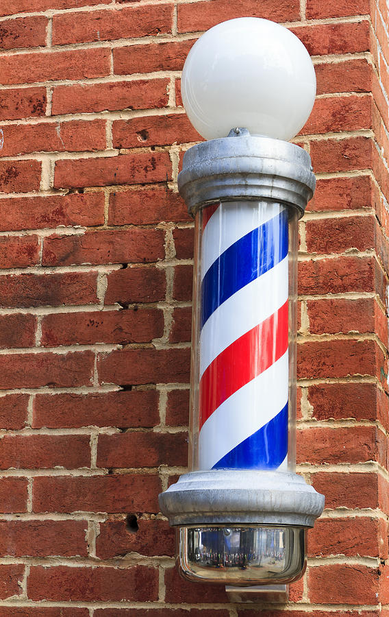 Old Fashioned Barbershop Pole On Brick Wall Photograph by WilliamSherman