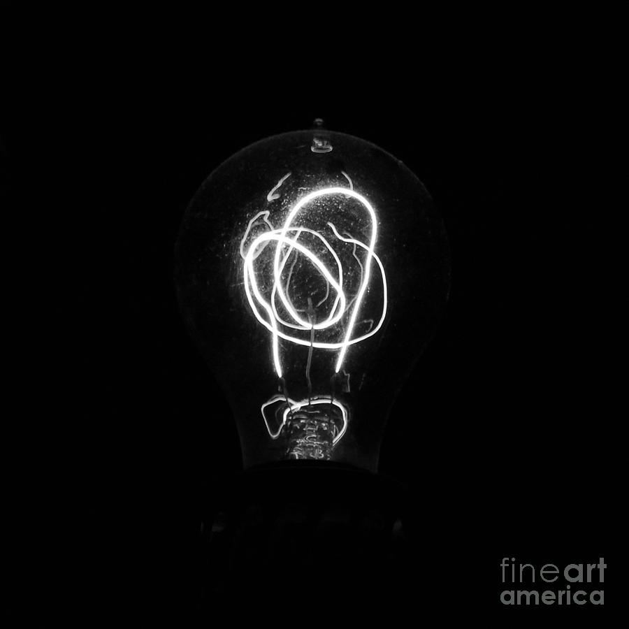 Black And White Photograph - Old Fashioned Edison Lightbulb Filaments Macro Black and White by Shawn OBrien