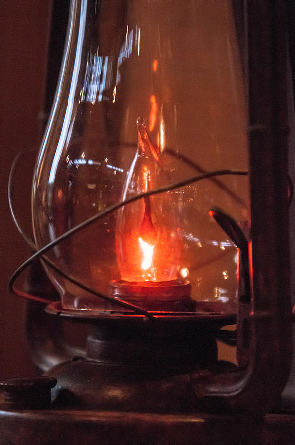 Old fashioned lantern in darkness.   Photograph by Alex Grichenko