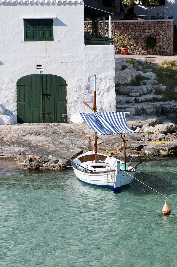 Typical mediterranean fishermen villa in Alcaufar beach Minorca island  with llaut  Photograph by Pedro Cardona Llambias