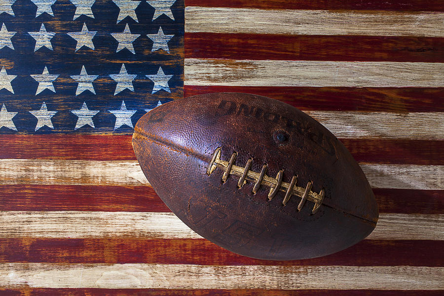 Football Photograph - Old Football On American Flag by Garry Gay