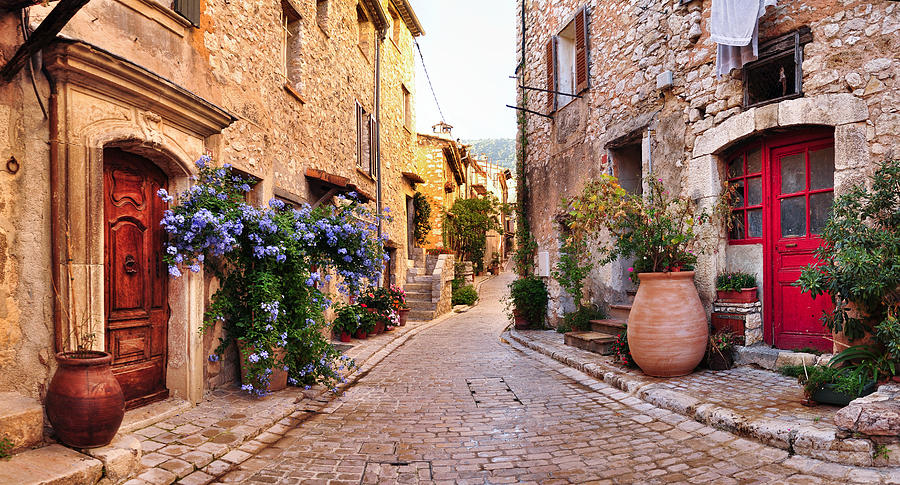 Old French village houses and cobblestone street Photograph by Paparazzit
