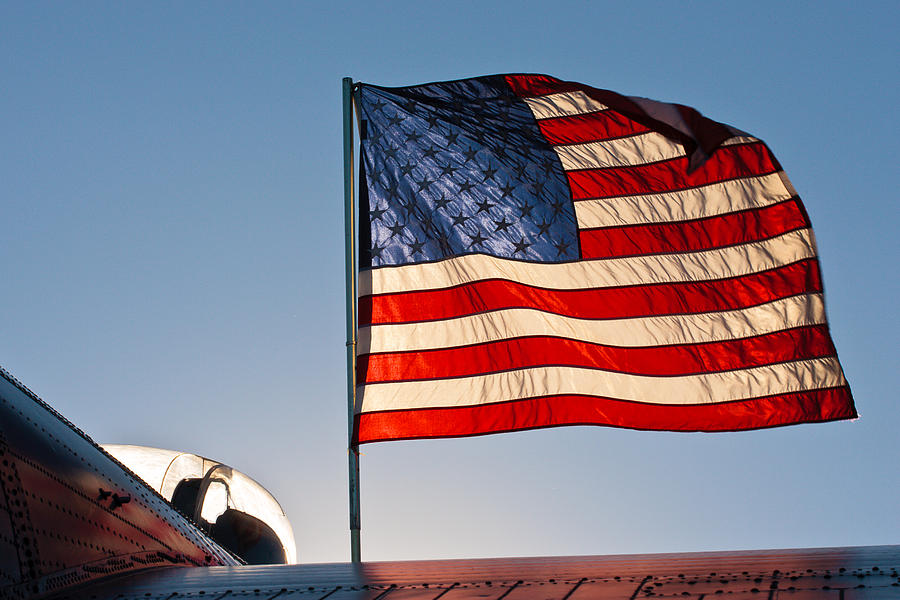 Old Glory Over The Liberator Photograph by Jeff Sinon