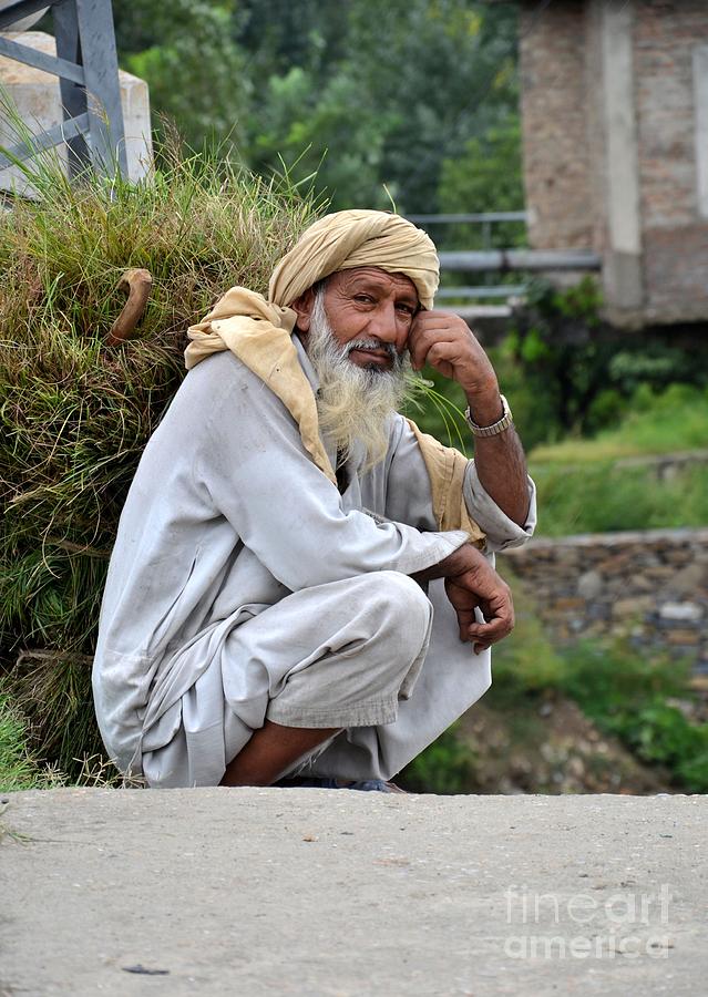 Old man carrying fodder Swat Valley KPK Pakistan Photograph by Imran Ahmed