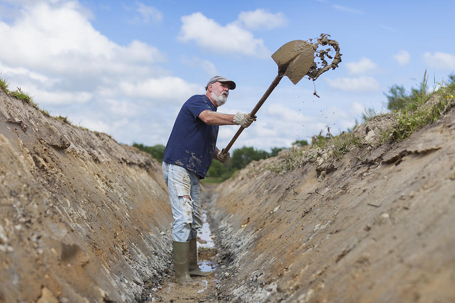 Old Man Digging A Ditch Photograph by Vandervelden