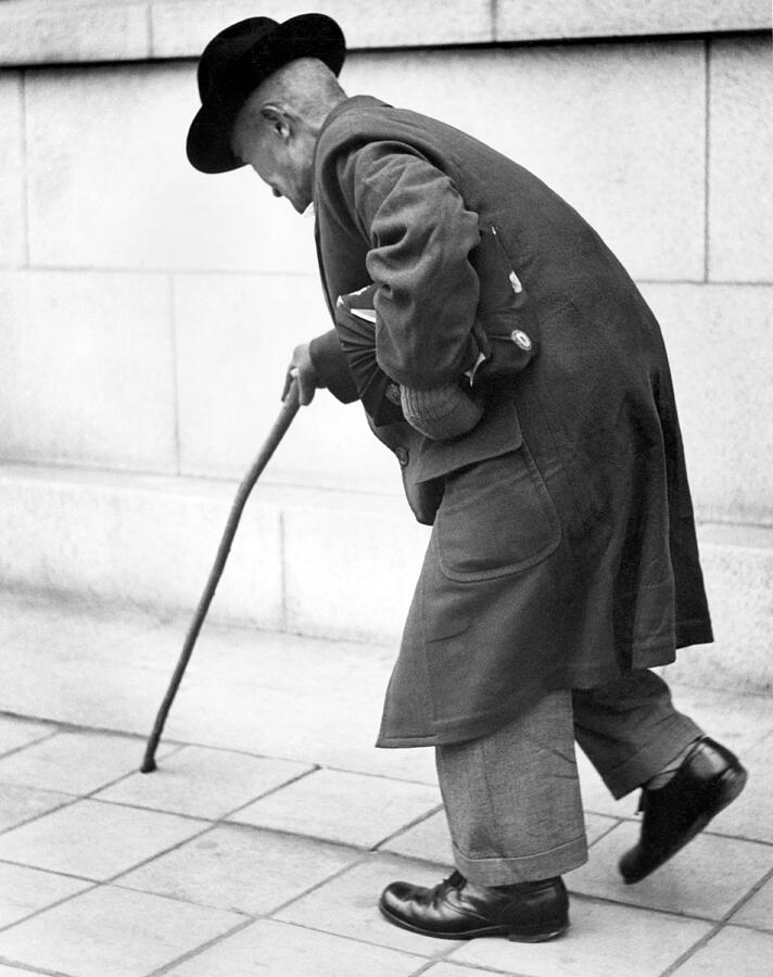 Old Man Walking With A Cane Photograph by Underwood Archives