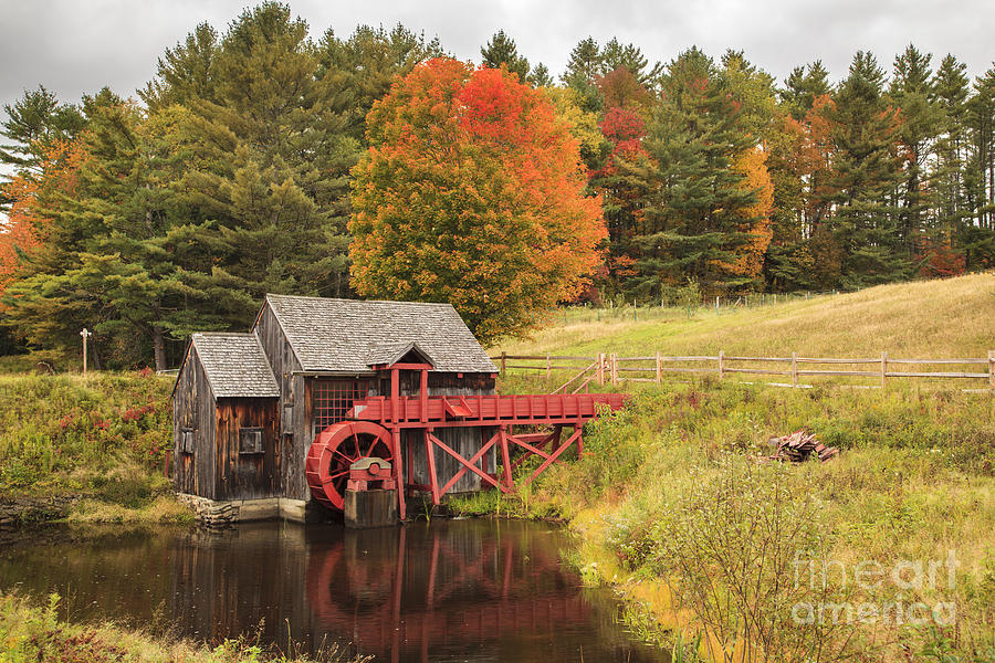 Old New England grist mill in Autumn Photograph by Ken Brown