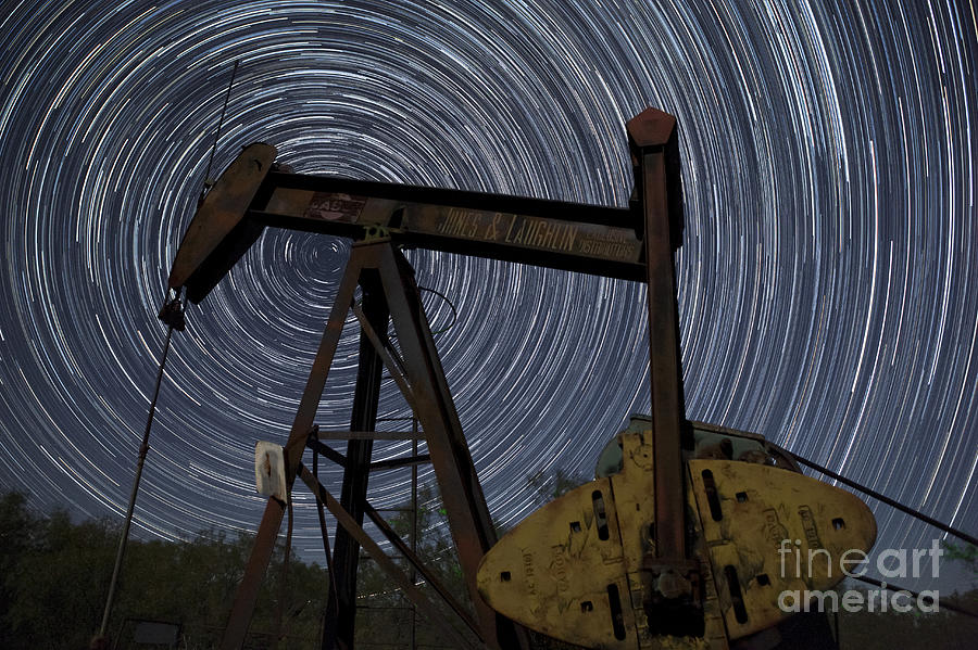 Night Sky Photograph - Old Oil Pump Deep in the Heart of Texas by Keith Kapple