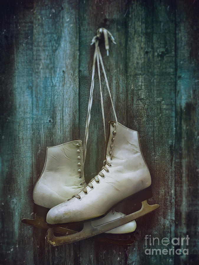 Old pair of womans skates hung on barn door             Photograph by Sandra Cunningham