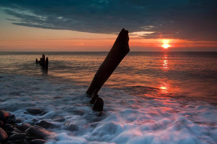 Old posts at sunset Photograph by Izzy Standbridge | Fine Art America