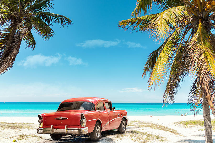 old red american car on Varadero Beach in Cuba Photograph by Golero