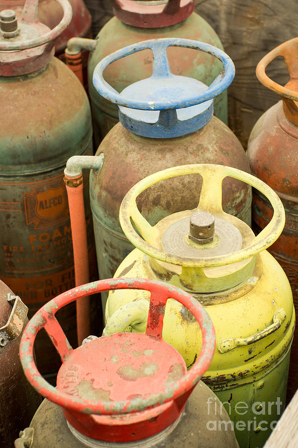 Colorful fire extinguishers Photograph by Imagery by Charly