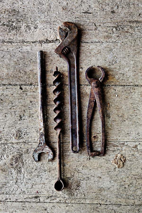 Old Rusty Tools On A Wooden Floor Photograph by Richard Boll