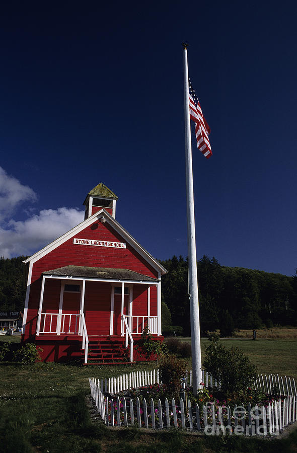 Old School House with American Flag Photograph by Jim Corwin