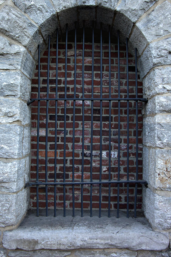 Architecture Photograph - Old stone entrance with steel bars by Heather Reeder