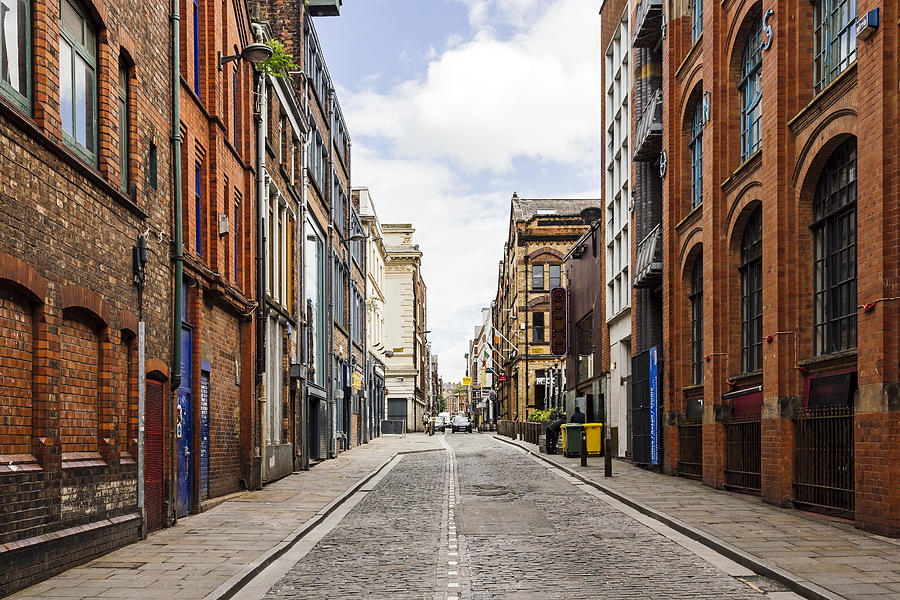 Old street with brick wall buildings in the downtown of Liverpool, England, UK Photograph by Alexander Spatari