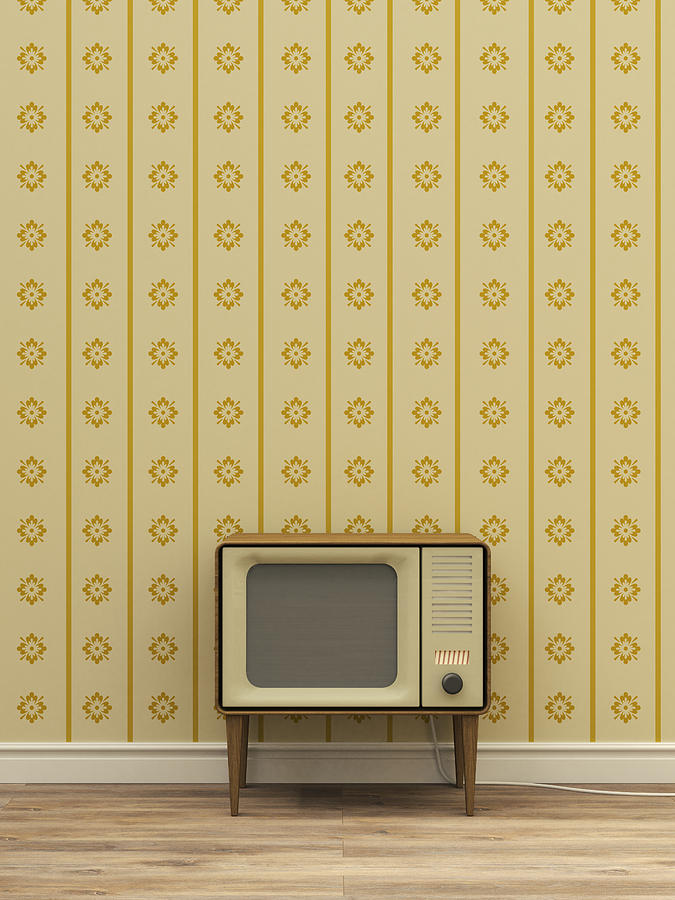 Old television in front of yellow patterned wallpaper Drawing by Westend61