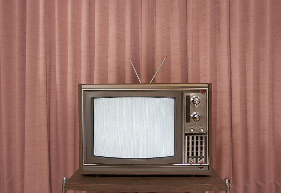 Old television on stand, in front of curtain Photograph by Steven Errico