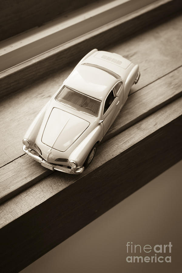 Old toy car on the window sill Photograph by Edward Fielding