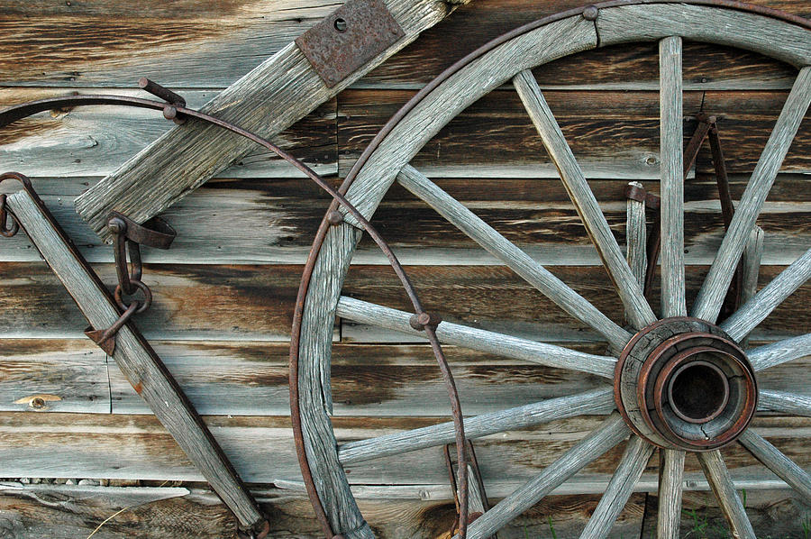 Old Wagon Wheel in Nevada City Montana Photograph by Bruce Gourley