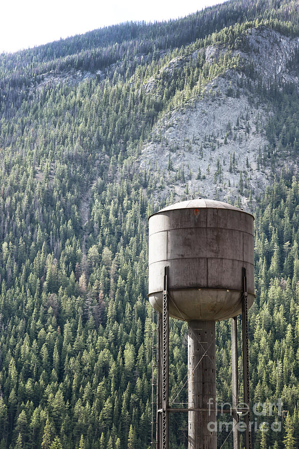 Old water tower in the Rockies Photograph by Sandra Cunningham