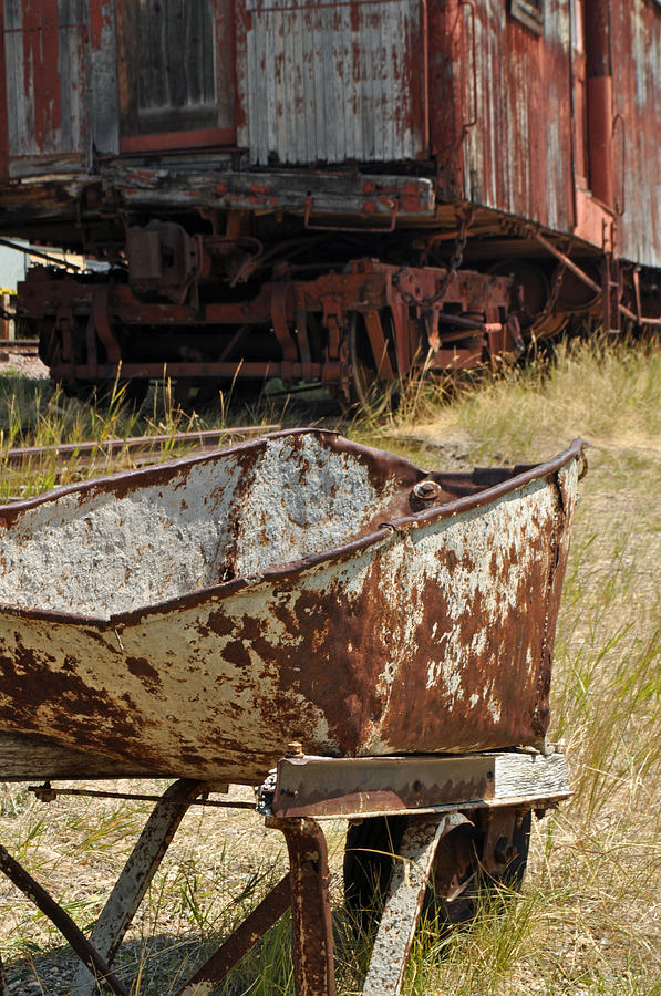 Old Wheelbarrow and Great Northern Pacific Boxcar Photograph by Bruce Gourley